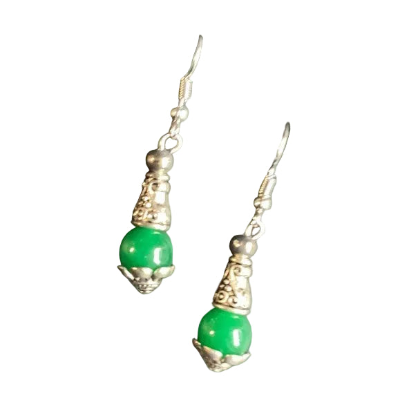 Heartfelt Creations green bead drop earrings with antique silver filigree detailing on a soft green satin fabric.