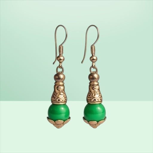 Heartfelt Creations drop earrings with vibrant green beads and intricate antique silver-toned filigree metalwork.