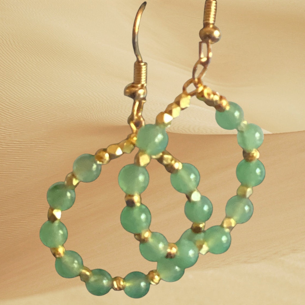 Heartfelt Creations handcrafted hoop dangle earrings featuring soft green gemstone beads and gold-tone metallic spacers.
