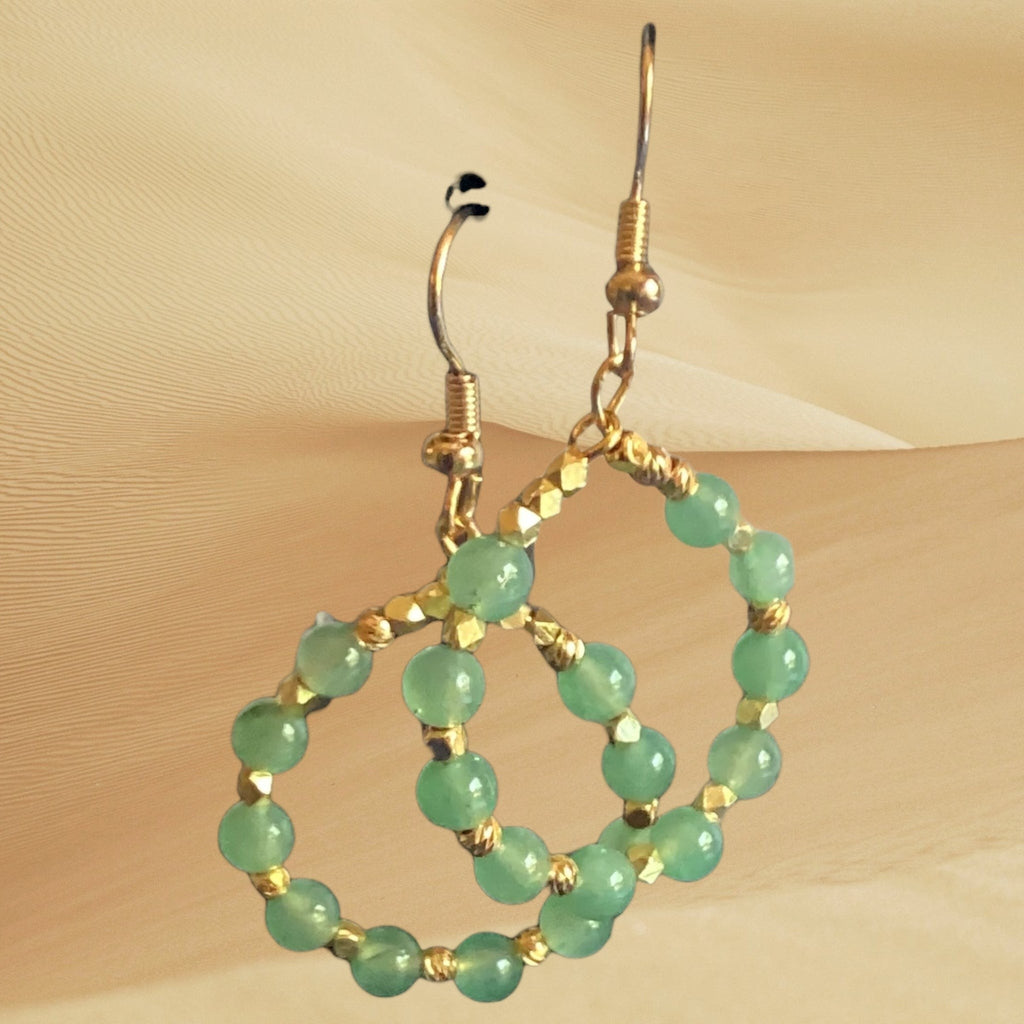 Heartfelt Creations handcrafted hoop dangle earrings featuring soft green gemstone beads and gold-tone metallic spacers.