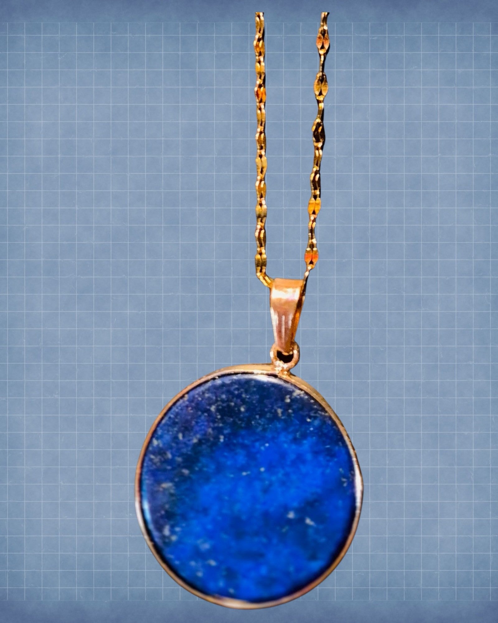 Heartfelt Creations round Lapis Lazuli pendant necklace with a polished gold-tone setting and textured chain.