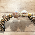 Heartfelt Creations handmade bracelet with large iridescent marbled beads, gold-tone faceted beads, and champagne rondelles.
