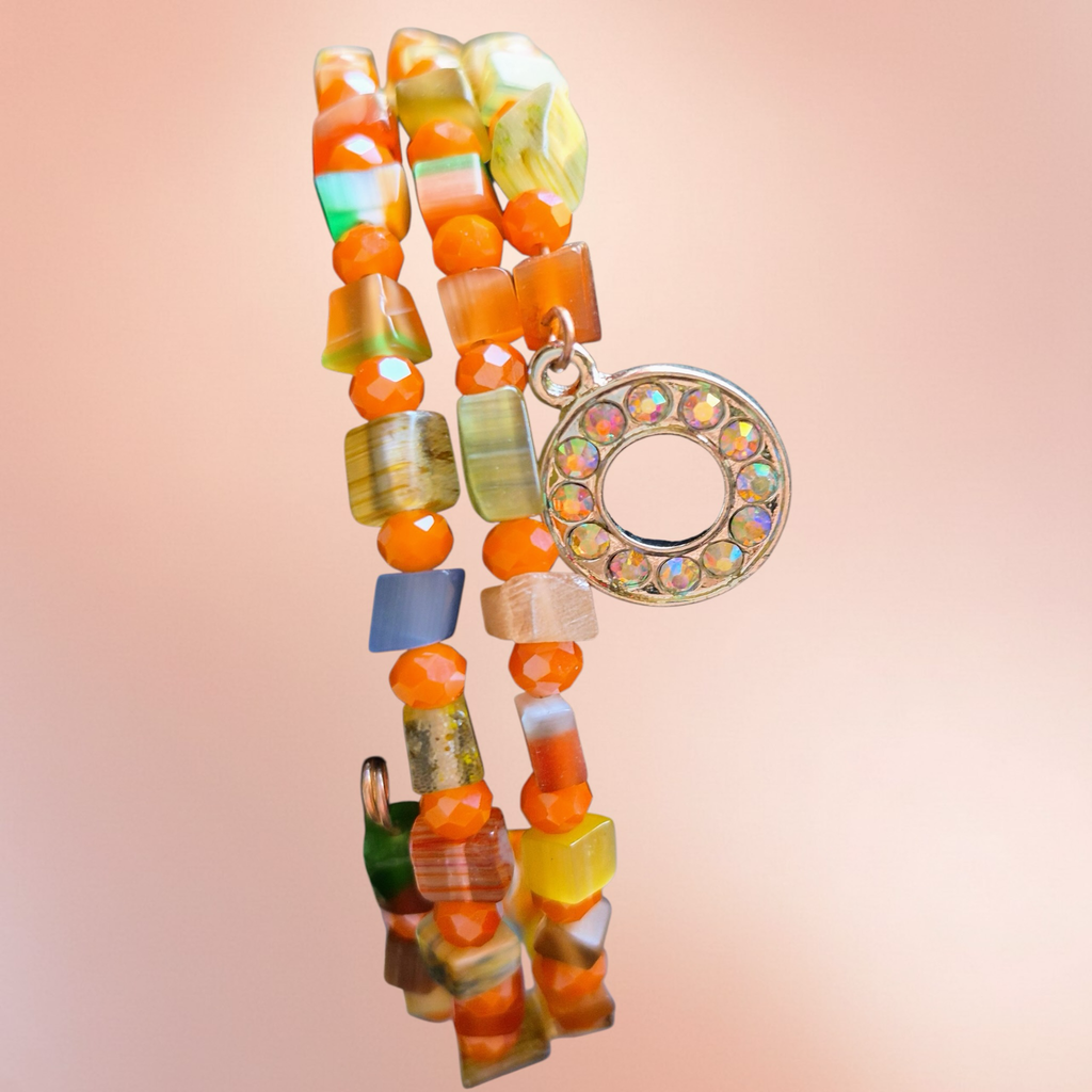 Heartfelt Creations multicolor beaded wrap bracelet with toggle clasp, featuring orange, green, and brown natural stones.