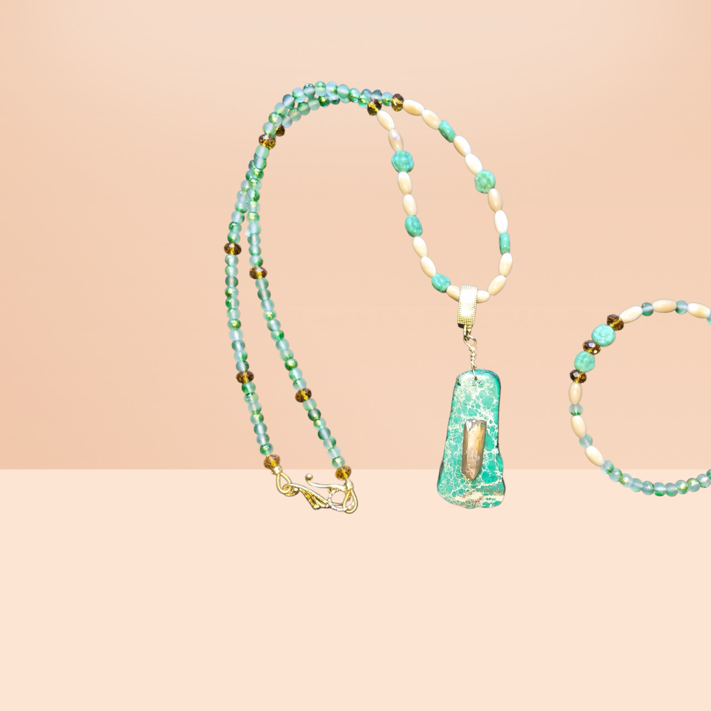 Heartfelt Creations ocean-inspired necklace with seafoam green beads, shell beads, amber accents, and a green stone pendant with quartz.