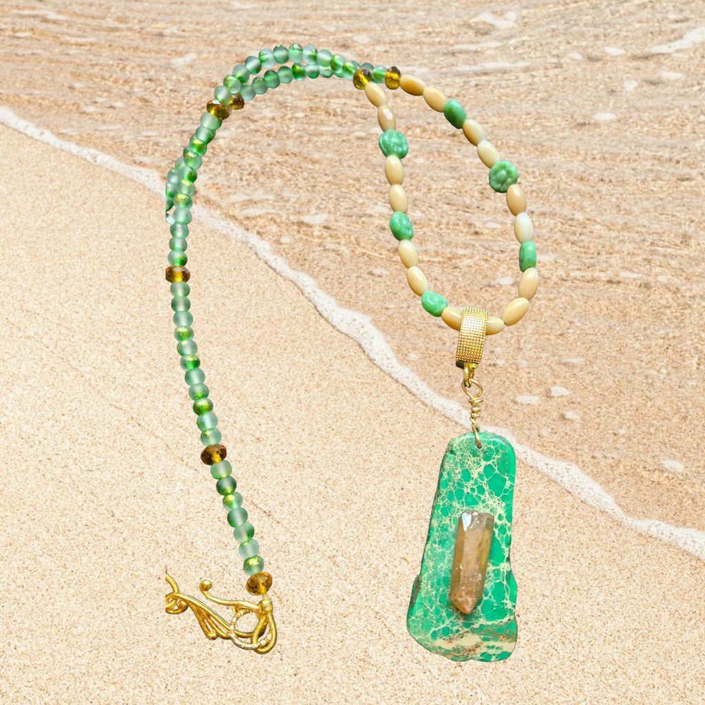 Heartfelt Creations ocean-inspired necklace with seafoam green beads, shell beads, amber accents, and a green stone pendant with quartz.