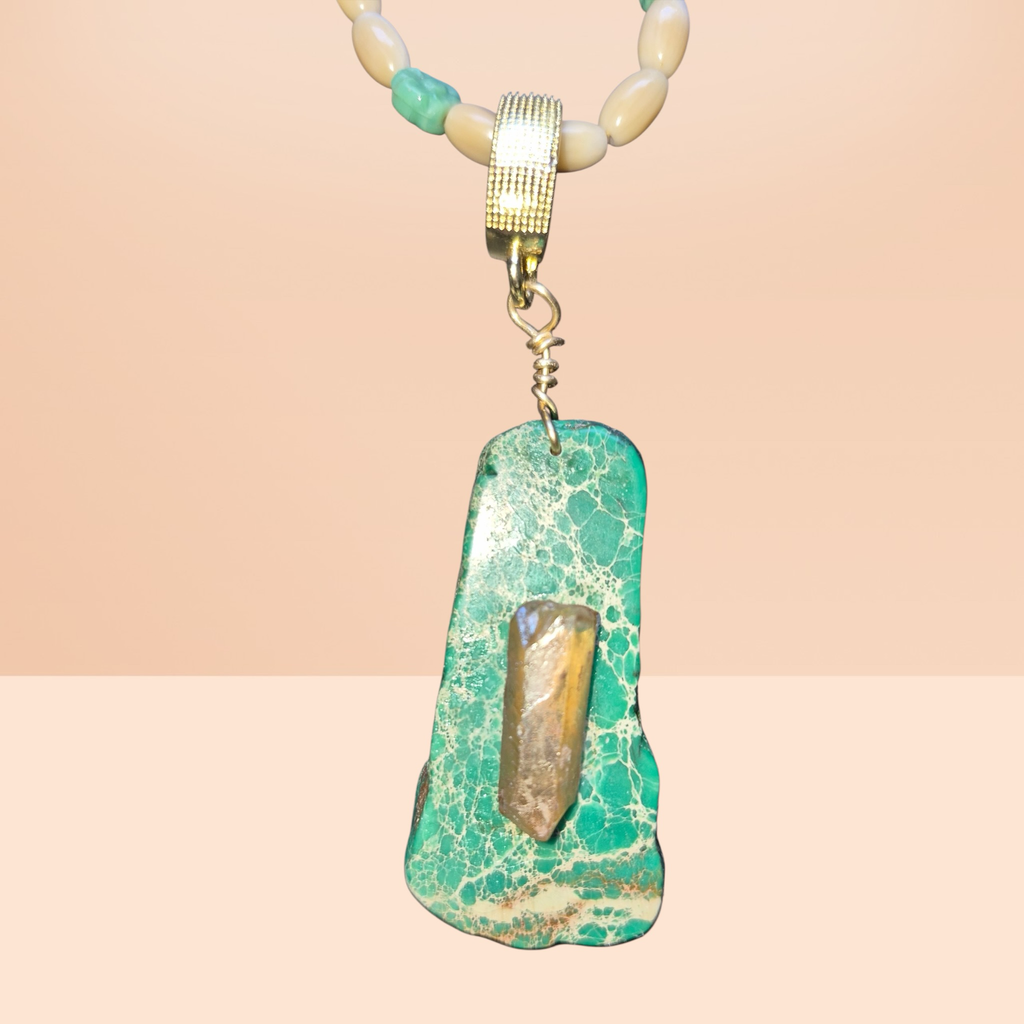 Heartfelt Creations ocean-inspired necklace with seafoam green beads, shell beads, amber accents, and a green stone pendant wire-wrapped with quartz.