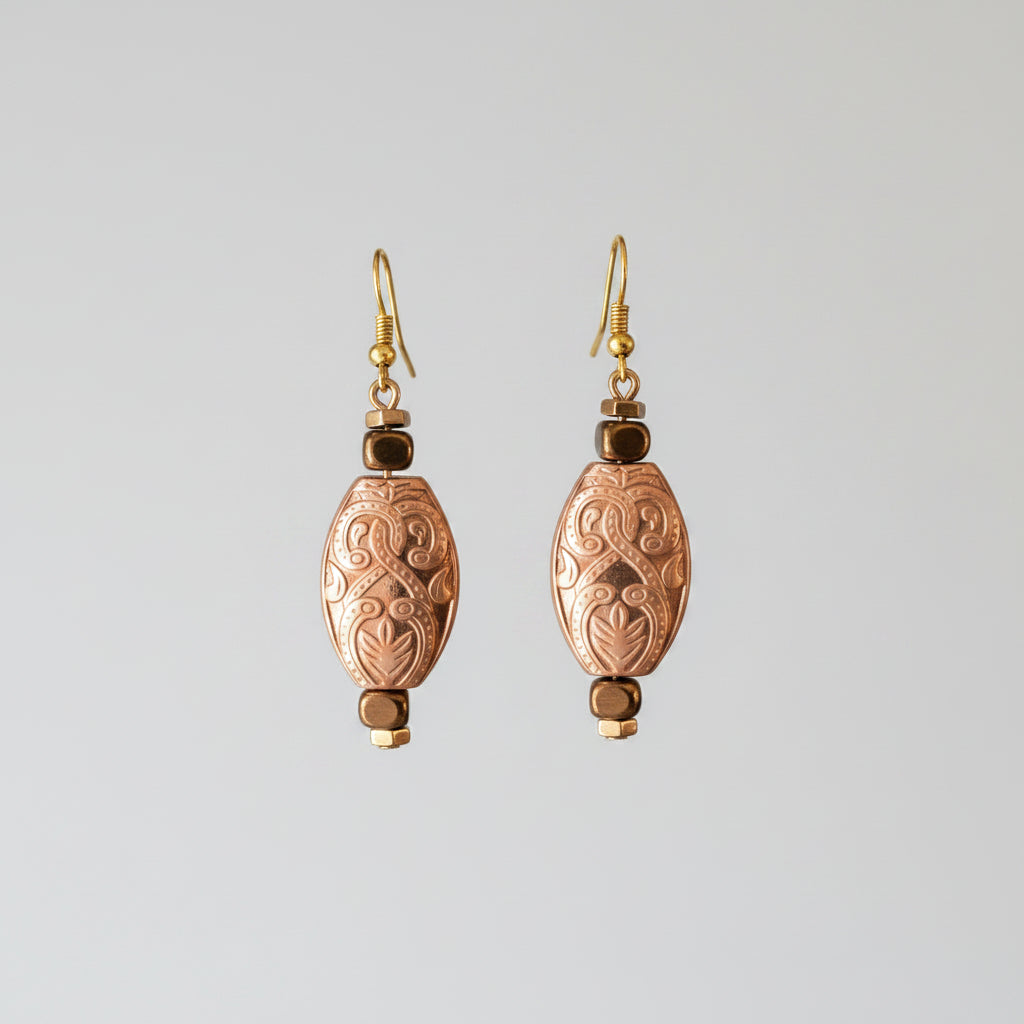 Heartfelt Creations elegant oval embossed dangle earrings with antique brass finish and faceted metallic beads.