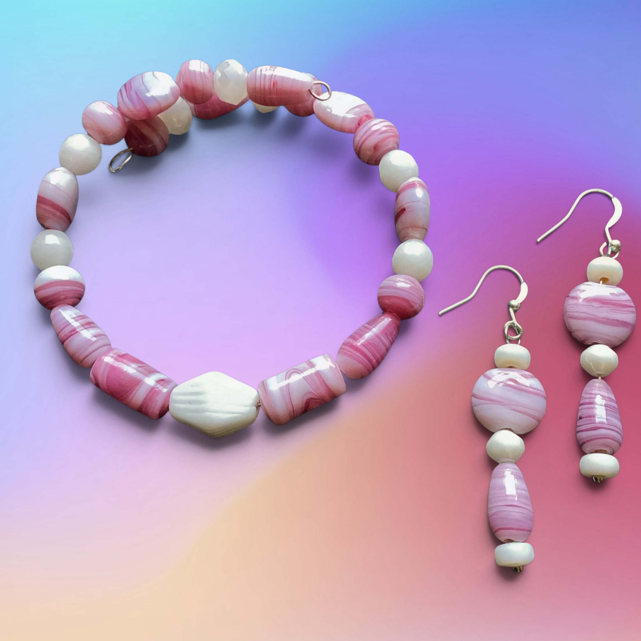 Heartfelt Creations handcrafted jewelry set with pink marbled glass and white beads, including bracelet and earrings.