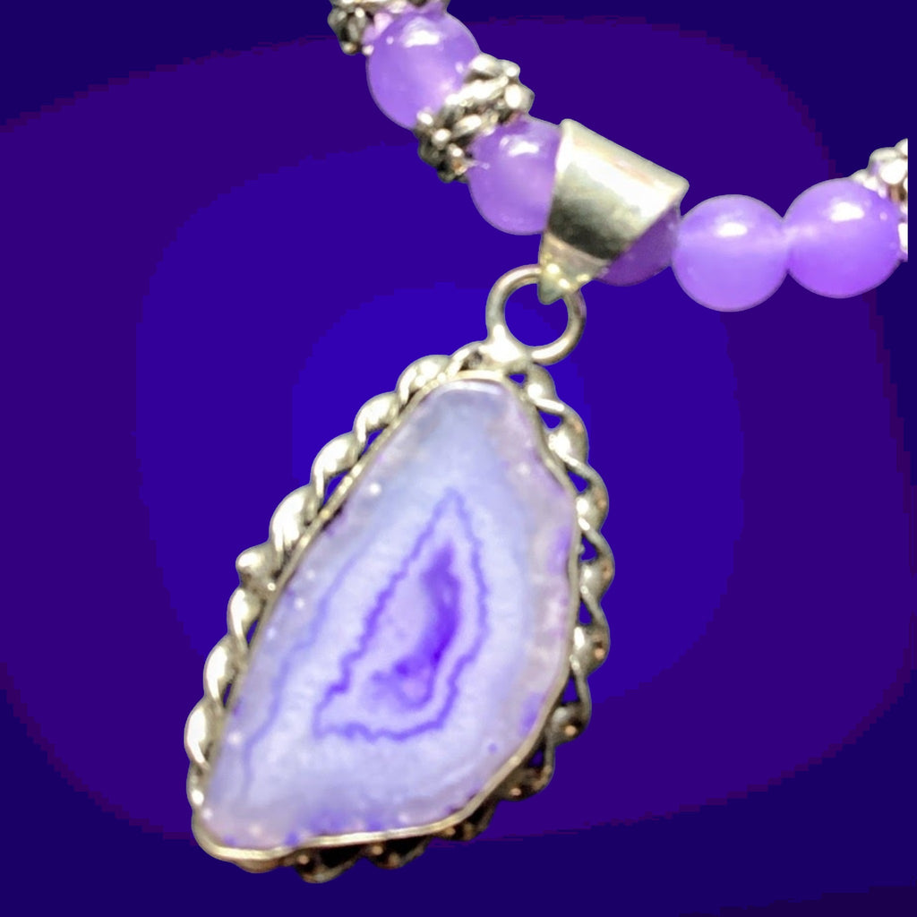 Heartfelt Creations purple beaded necklace with agate pendant and silver accents.