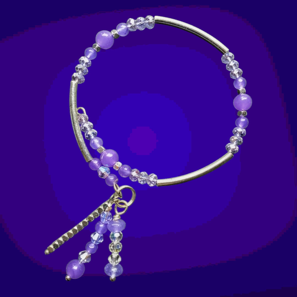 Heartfelt Creations purple beaded bracelet with silver accents and a dangling charm.