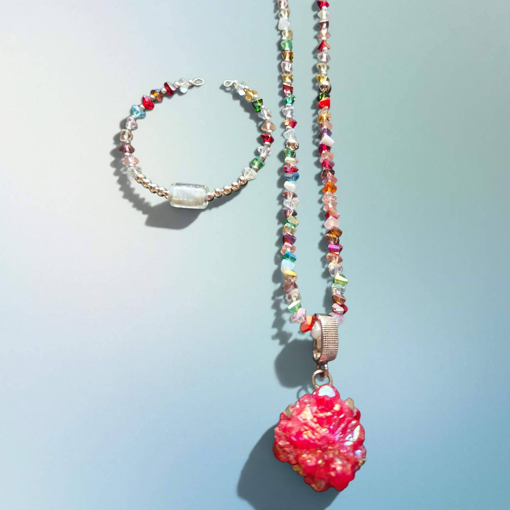 Heartfelt Creations handmade rainbow crystal beaded necklace with pink druzy pendant and matching bracelet.