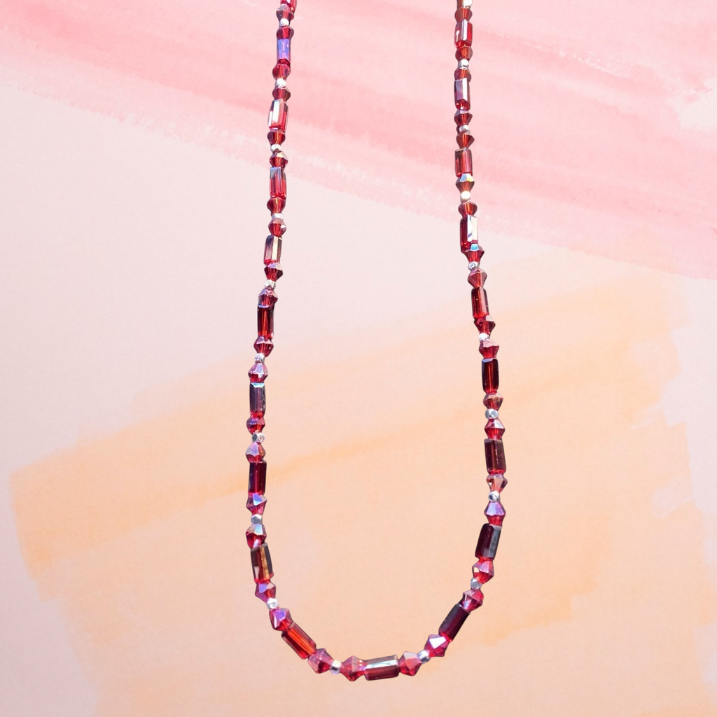 Heartfelt Creations ruby-red crystal beaded statement necklace with faceted rectangular crystals and silver accents.