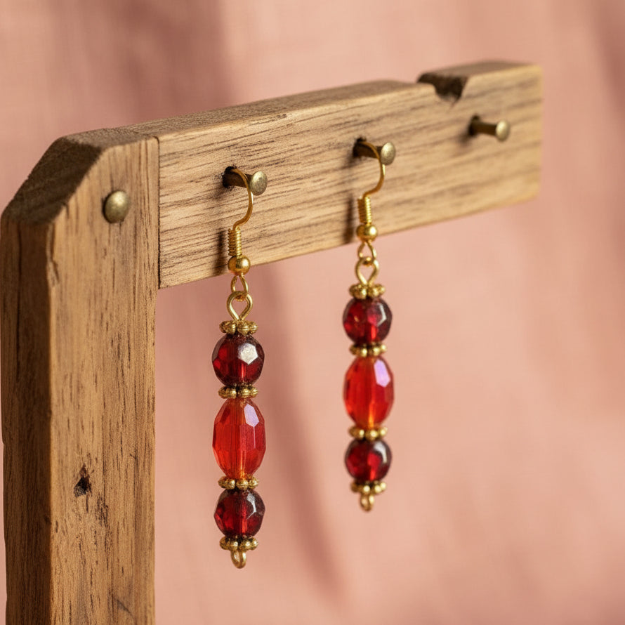 Heartfelt Creations red crystal beaded drop earrings with gold-tone accents and hook backings on a white background.