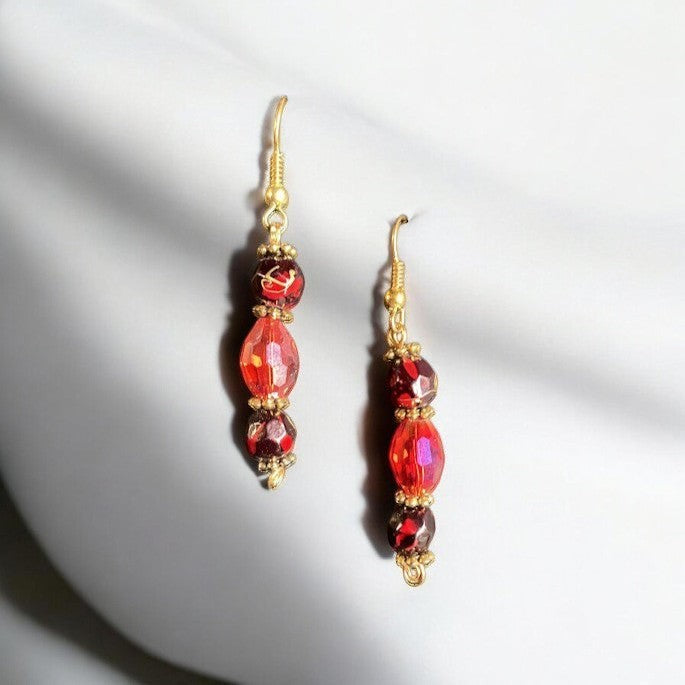 Heartfelt Creations red crystal beaded drop earrings with gold-tone accents and secure hook backings.