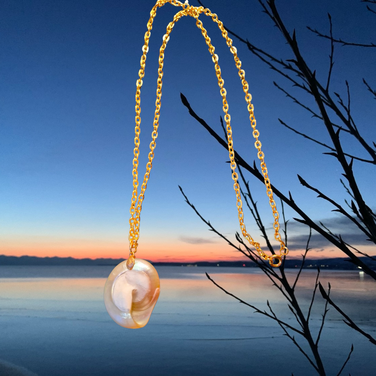 Heartfelt Creations Ocean Swirl Shell Pendant Necklace with gold chain, iridescent natural shell, unique spiral design.