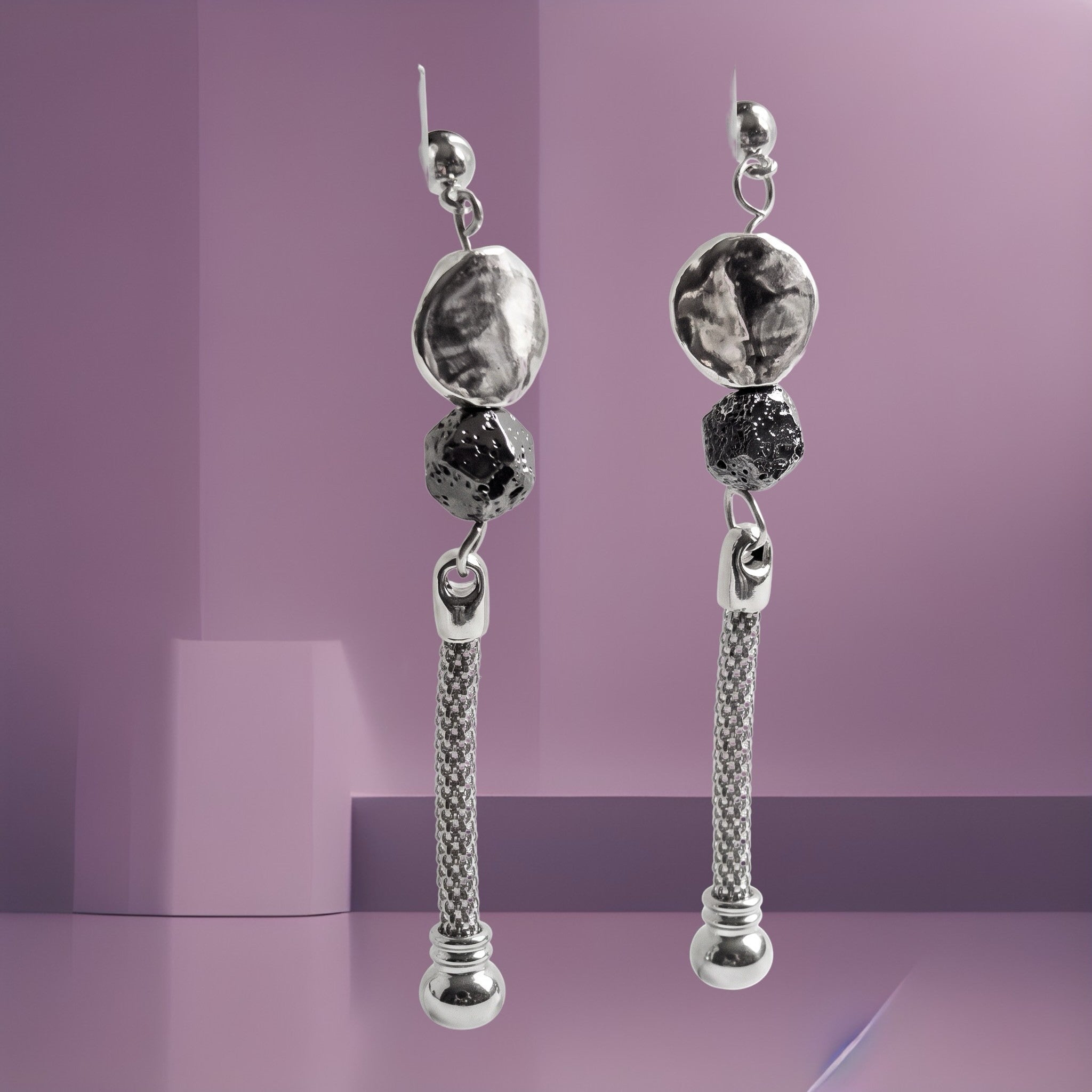 Heartfelt Creations long drop earrings featuring hammered silver discs, dark textured beads, and mesh chain drops.