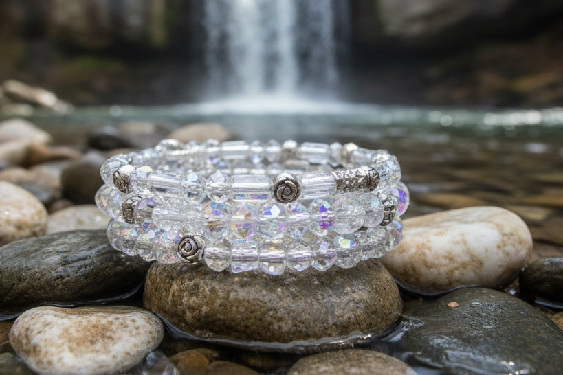 Heartfelt Creations sparkling coil bracelet with clear iridescent crystal beads and silver-tone charms.
