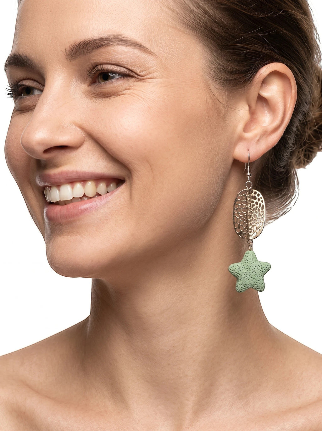 Heartfelt Creations textured light green porous stone star drop earrings with silver-tone hammered oval accents on model