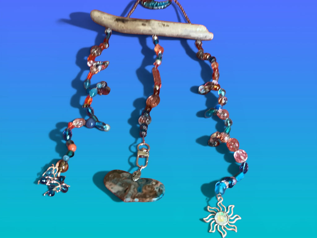 Heartfelt Creations suncatcher with driftwood, turquoise, gold glass, crystal beads, and heart stone.