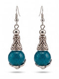 Heartfelt Creations ornate drop earrings with faceted teal stones and antiqued silver scrollwork metal detailing.