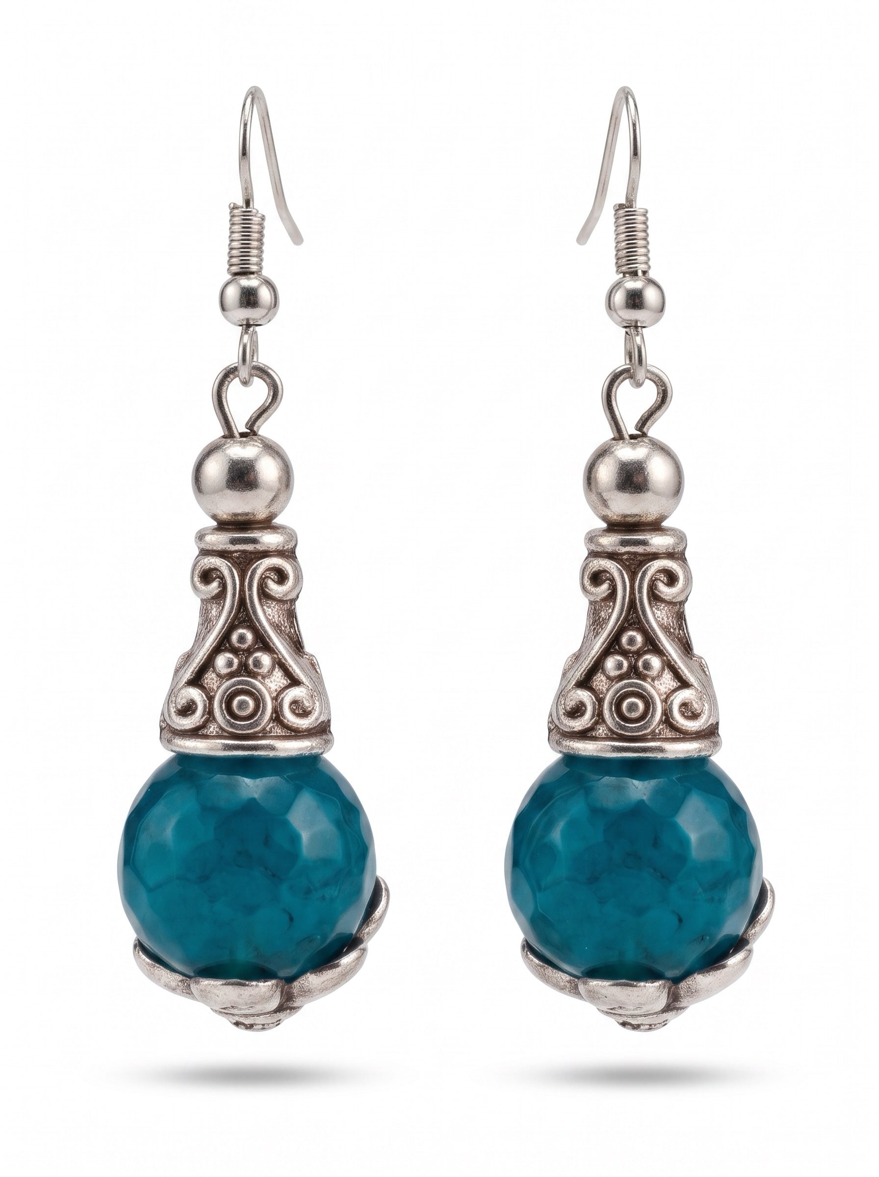 Heartfelt Creations ornate drop earrings with faceted teal stones and antiqued silver scrollwork metal detailing.