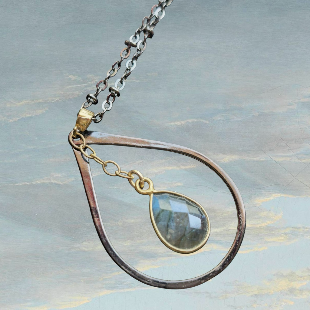 Heartfelt Creations teardrop pendant necklace with clear faceted gemstone and oxidized metal chain.