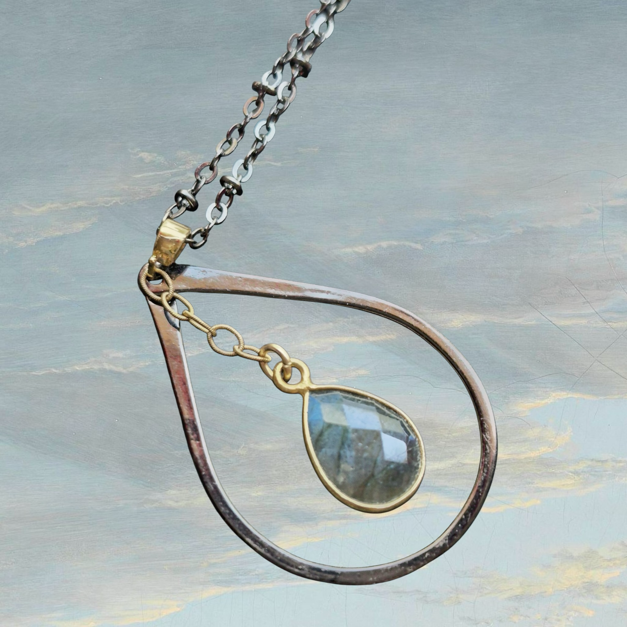 Heartfelt Creations teardrop pendant necklace with clear faceted gemstone and oxidized metal chain.