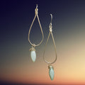 Heartfelt Creations teardrop hoop earrings with pale blue-green gemstone dangle and gold-tone filigree detail.