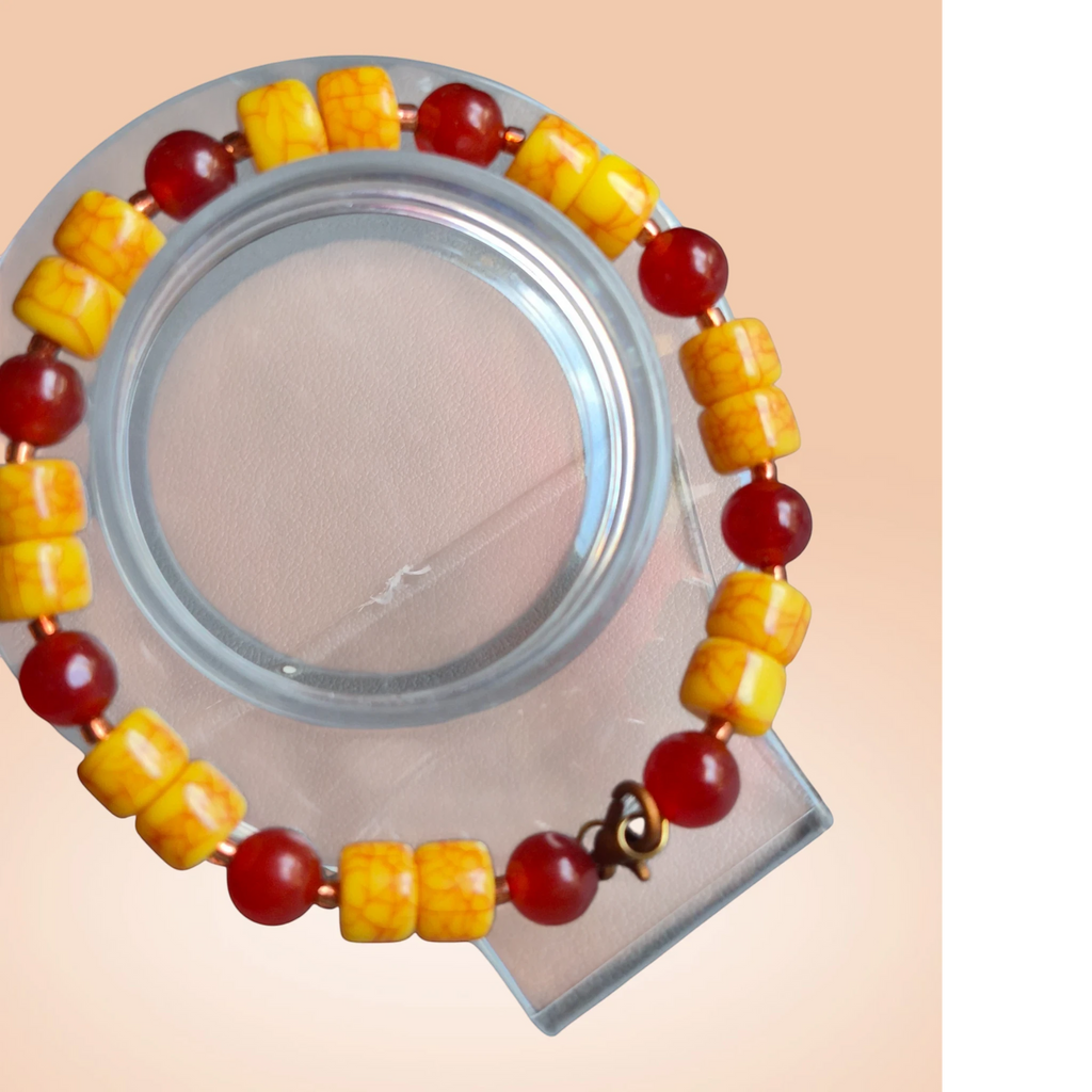 Heartfelt Creations beaded bracelet featuring yellow crackle-textured beads and translucent red accent beads