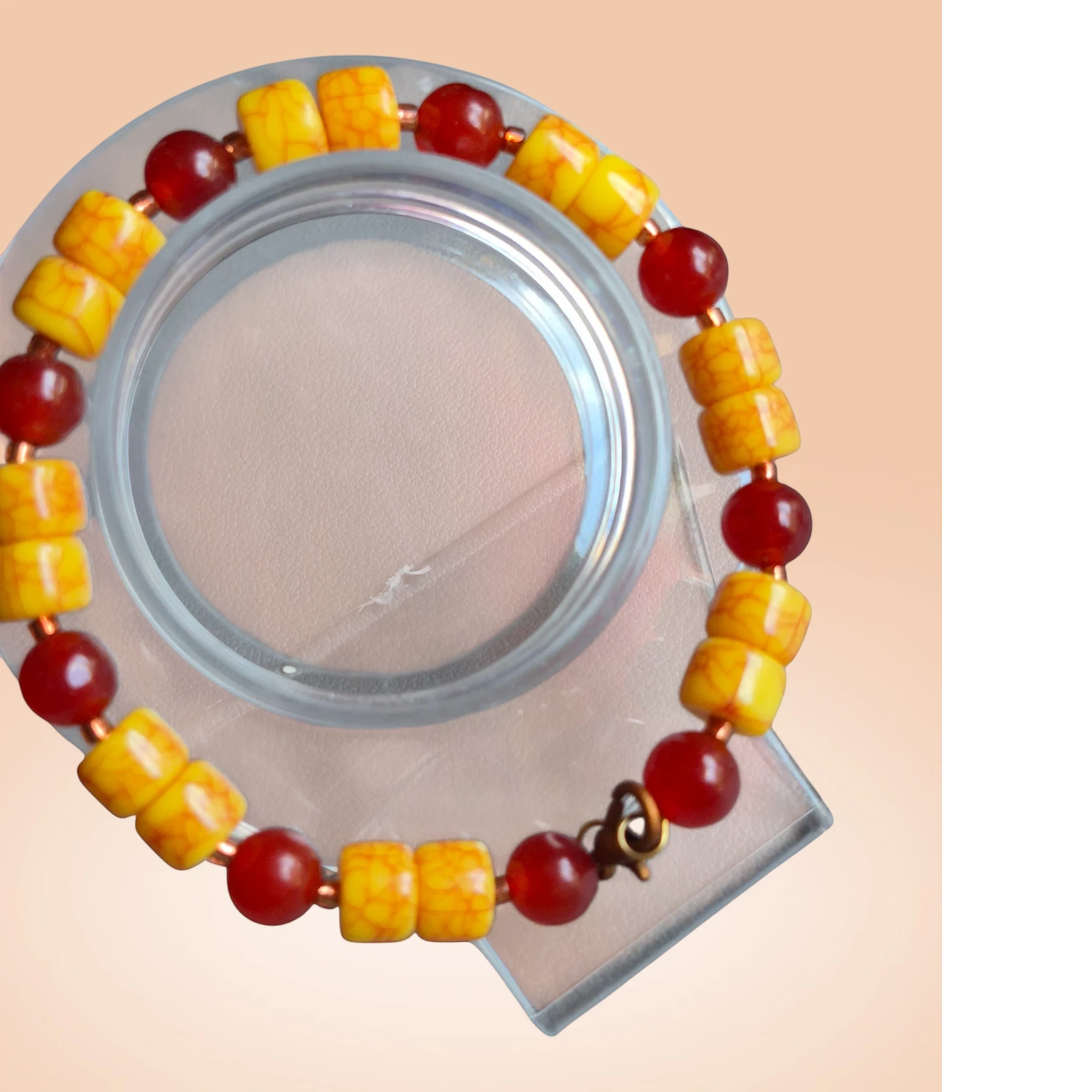 Heartfelt Creations beaded bracelet featuring yellow crackle-textured beads and translucent red accent beads