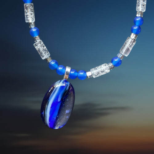 Jewelry set with necklace and earrings on a gradient background
