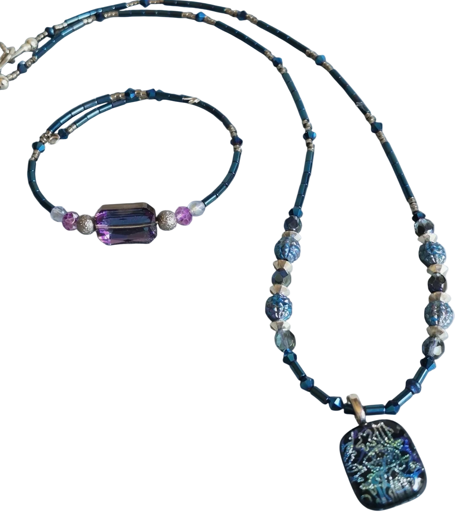 A beaded necklace with a rectangular iridescent shell pendant, displayed alongside a matching beaded bracelet on a plain white background.