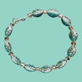 Oval Beaded Bracelet With Floral Design